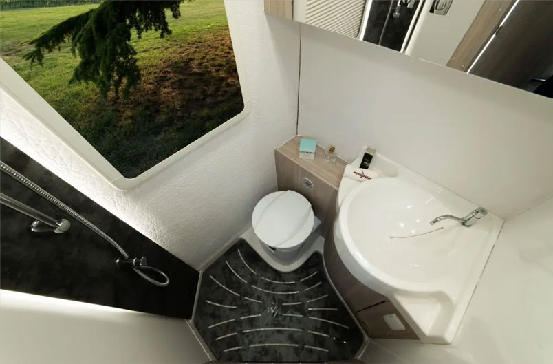 Overhead view of shower, toilet, and washroom sink